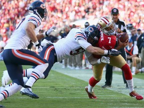 Quarterback Colin Kaepernick #7 of the San Francisco 49ers gets hit by outside linebacker Shea McClellin #50 of the Chicago Bears during the first quarter of their game against the Chicago Bears at Levi's Stadium on September 14, 2014 in Santa Clara, California.
(Jeff Gross/Getty Images)
