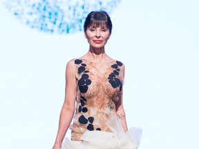 Skye Natasha Lintott of Skye Berry Pie glides down the catwalk in a wearable art piece from Green Embassy at Vancouver Fashion Week S/S 2015