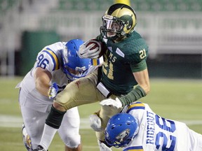 Regina Rams running back Jared Janotta is pursued by UBC's Donovan Dale (left) and Bryan Rideout on Friday in Regina. (Photo -- Regina Leader Post)