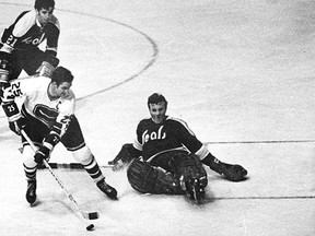 Vancouver Canucks captain Orland Kurtenbach gets the goalie going down, and scores a goal on the California Seals in this photo from Dec. 14, 1970. He finished the game with a hat trick.