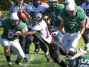Kyle Takashima (right, 35) of the Lord Tweedsmuir Panthers attempts to tackle Terry Fox Ravens’ Keishon Ross during Triple A football action Saturday in Surrey. (Jenelle Schneider, PNG)