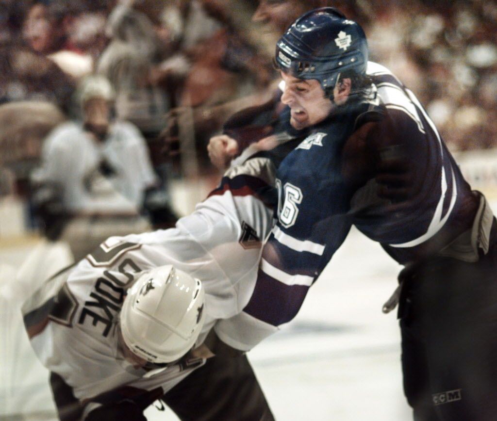 PRV092400Canucks 02 - SEE Sports - SEPT 24/2000 - Vancouver, BC - Vancouver Canuck Matt Cooke (24) and Toronto Maple Leaf's Darcy Tucker trade blows during exhibition play.  Province photo by Colin Price. [PNG Merlin Archive]