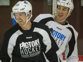 Canucks Shawn Matthias, right, and captain Henrik Sedin,  share a laugh during an informal practice with several other teammates at Britannia Rink. (Photo:
 Ric Ernst / PNG)