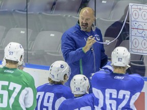 Vancouver Canuck prospects listen to Dave Babych at last year's Young Stars tournament in Penticton.  (Photo: Ward Perrin/PNG)