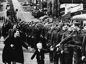 The photo "Wait for me, Daddy" shows Private Jack Bernard, B.C. Regiment (Duke of Connaught's Own Rifles) saying goodbye to his five-year-old son Warren Bernard as he leaves for the Second World War in New Westminster on Oct. 1, 1940. (Claude Dettloff/PNG FILES)