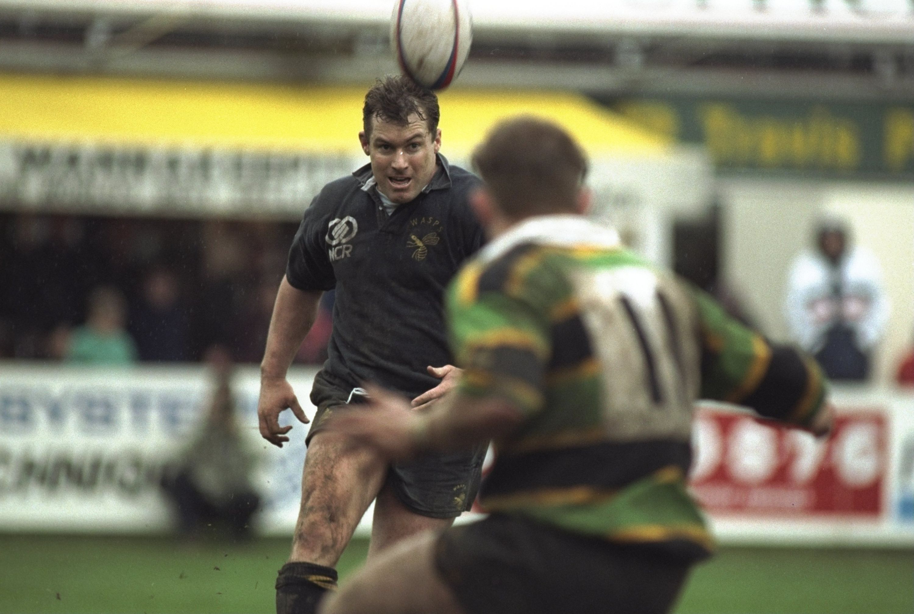 26 Apr 1997:  Gareth Rees (left) of Wasps kicks the ball forward during the Courage League Division One match against Northampton at Franklins Gardens in Northampton, England. Wasps won 15-36 and secured the Division One title.  Mandatory Credit: David Rogers /Allsport