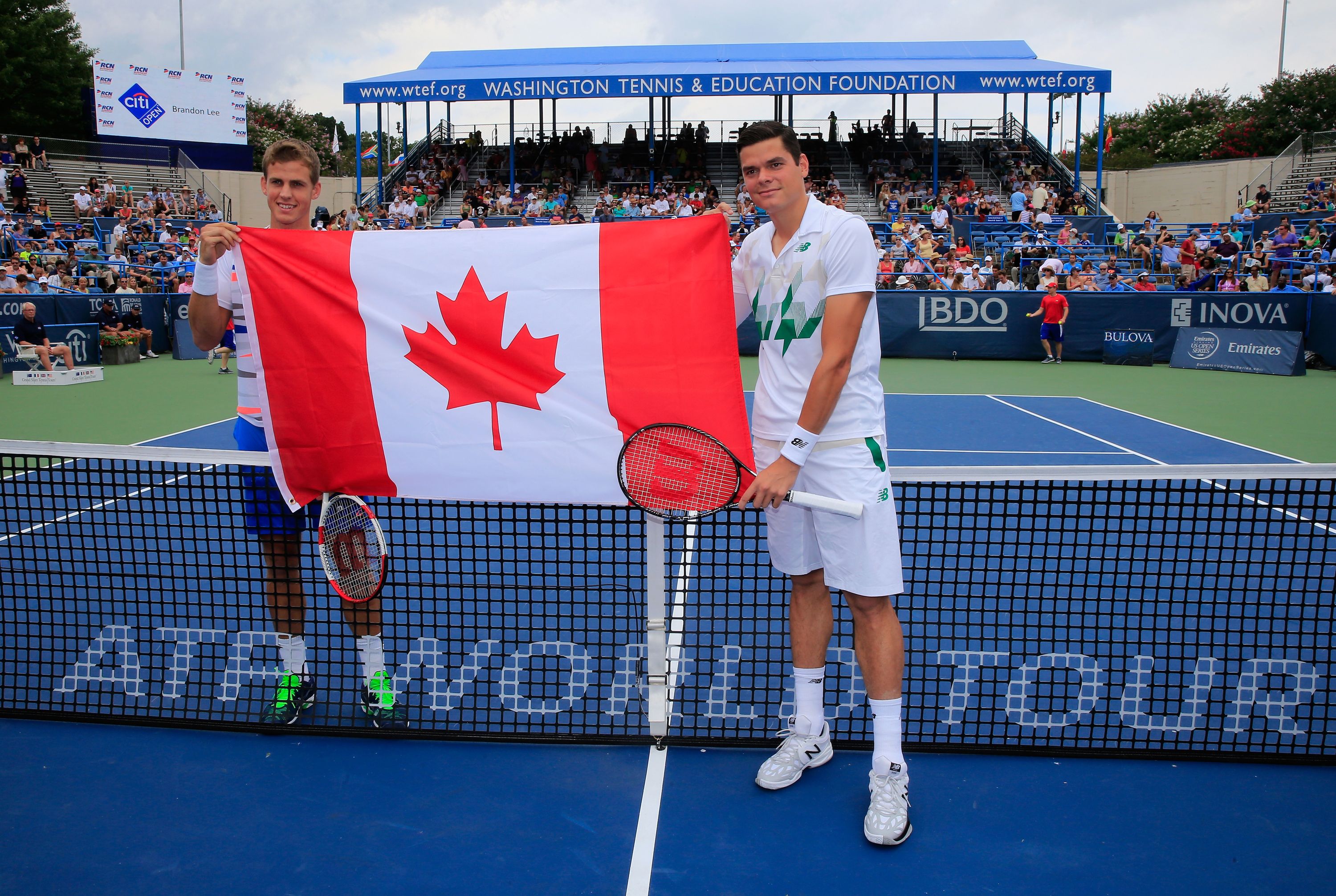 WASHINGTON, DC - AUGUST 03:  Vasek Pospisil (L) and Milos Raonic of Canada pose with the Canadian flag before the start of the mens final of the Citi Open at the William H.G. FitzGerald Tennis Center on August 3, 2014 in Washington, DC.  (Photo by Rob Carr/Getty Images)