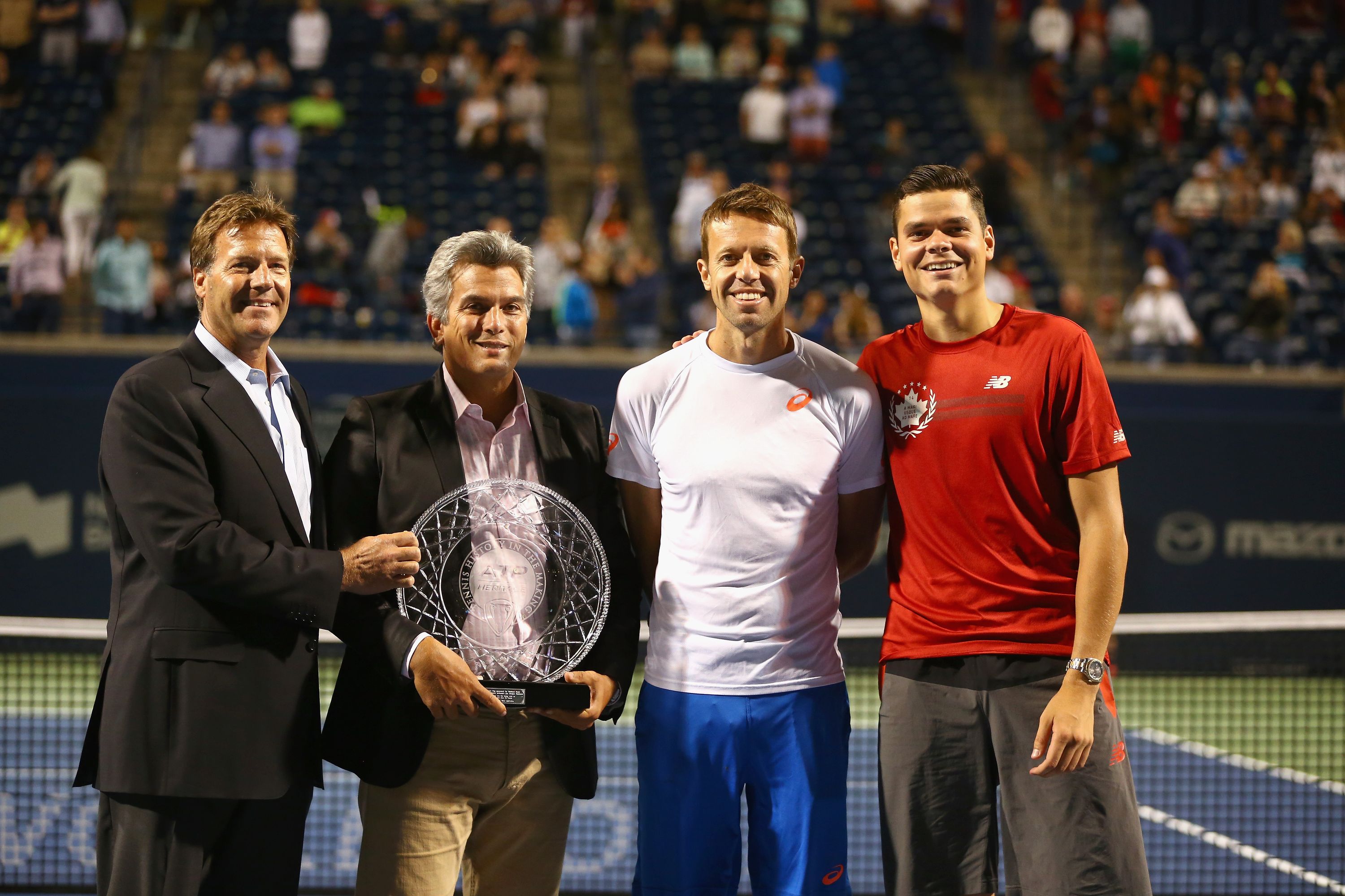 TORONTO, ON - AUGUST 06:  (L-R) Mark Young, CEO ATP Americas and Chief Legal and Media Officer, Karl Hale, Tournament Director, Daniel Nestor and Milos Raonic with the 25 Years of ATP World Tour- ATP Heritage Award Progamme during Rogers Cup at Rexall Centre at York University on August 6, 2014 in Toronto, Canada.  (Photo by Ronald Martinez/Getty Images)