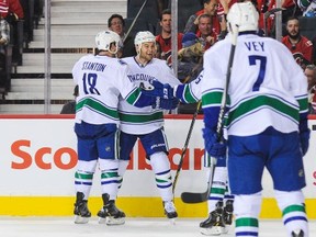 CALGARY, AB - OCTOBER 8: Zack Kassian #9 of the Vancouver Canucks celebrates after scoring his team's second goal against the Calgary Flames during an NHL game at Scotiabank Saddledome on October 8, 2014 in Calgary, Alberta, Canada. (Photo by Derek Leung/Getty Images)