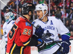 Bollig vs. Bieksa. That's a jaw-session. (Photo by Derek Leung/Getty Images)