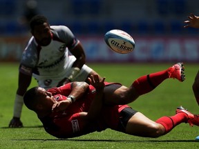 It was a tough day one for Mike Fuailefau and his Canada teammates at the Gold Coast Sevens. (Photo by Mark Metcalfe/Getty Images)