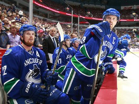 Canucks captain
Henrik Sedin, right,  says he's fine to play on Tuesday night against Carolina. (Photo by Jeff Vinnick/NHLI via Getty Images)