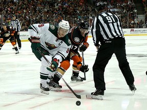Careful, Mikko Koivu, might not want to turn your back on Ryan Kesler. (Stephen Dunn/Getty Images)