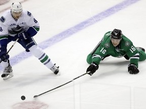 Not such a good start to the road trip for Chris Tanev (AP Photo/Tony Gutierrez)