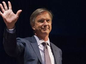 NPA mayoral candidate Kirk LaPointe waves to the crowd after getting introduced at a panel discussion last week.