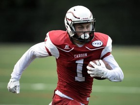 Carson Graham's Lucas Bill looks for open space Saturday as part of his Eagles' dramatic 49-48 win over the crosstown Handsworth Royals in the annual Buchanan Bowl. (PNG photo)