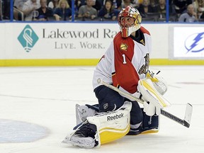Roberto Luongo allows an overtime goal by Lightning defenceman Victor Hedman on Thursday.