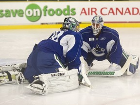 Jacob Markstrom and Ryan Miller in happier times. Well, at least in training camp.