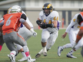 Mt. Douglas Rams' running back Pato Vega looks for running room against the New Westminster Hyacks during Friday's clash of provincially-ranked Triple A powers at Mercer Stadium. (Richard Lam, PNG photo