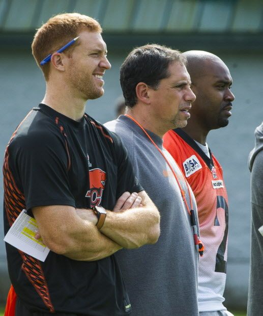 SURREY, BC: SEPTEMBER 9, 2014 - BC Lions injured quarterback Travis Lulay, left and replacement Kevin Glenn, right flank head coach Mike Benevides, centre during a practice at the CFL team's training facility in Surrey Tuesday September 9, 2014.  (Ric Ernst / PNG)  (Story by sports)  TRAX #: 00031631A & 00031631B [PNG Merlin Archive]