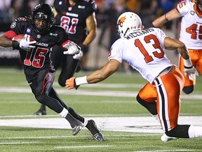 Jamill Smith of the Ottawa Redblacks rushes against B.C.'s Torri Williams Sept. 5 in Ottawa.