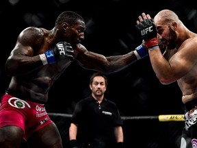 RIO DE JANEIRO, BRAZIL - OCTOBER 25:  Phil Davis of the United States punches Glover Teixeira of Brazil in their light heavyweight bout during the UFC 179 event at Maracanazinho on October 25, 2014 in Rio de Janeiro, Brazil.  (Photo by Buda Mendes/Getty Images)