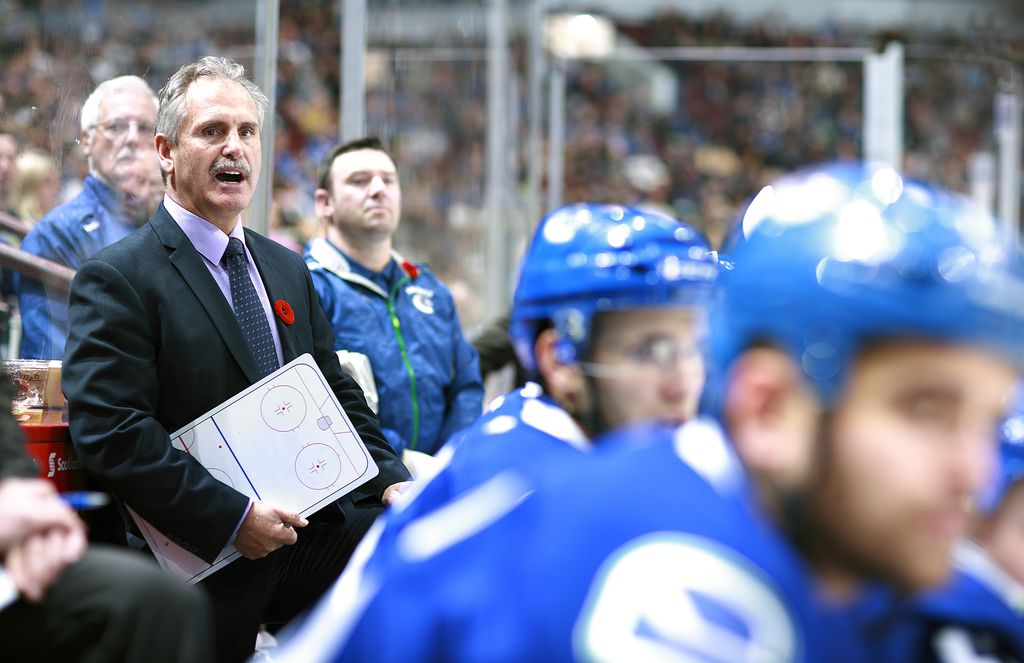 VANCOUVER, BC - NOVEMBER 2:  Head coach Willie Desjardins of the Vancouver Canucks looks on from the bench during their NHL game against the Nashville Predators at Rogers Arena November 2, 2014 in Vancouver, British Columbia, Canada. (Photo by Jeff Vinnick/NHLI via Getty Images)