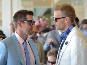 NFL stars Aaron Rodgers and Tom Brady enjoy the 2014 Kentucky Derby at Churchill Downs.