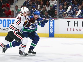 In his 1,000 game, Daniel Sedin gets to go up against longtime adversary Jonathan Toews and the rest of the Blackhawks.
(Photo by Jeff Vinnick/NHLI via Getty Images)