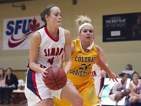 Simon Fraser University guard Elisa Homer drives the lane against Colorado Christian University's Taylor Torres in  Women's GNAC Basketball at SFU West Gym on Monday. (Ron Hole, SFU)
