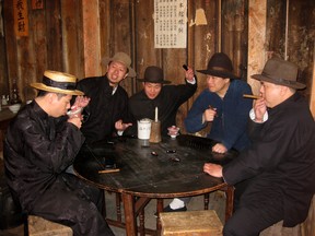 Producer Kevin Li (second from left) and other actors perform a re-enactment in Barkerville for the 2011 documentary, Brotherhoods, Clans and Secret Societies of Vancouver's Chinatown. (Credit: Submitted)
