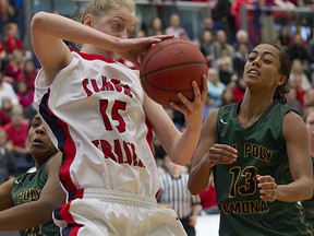 Simon Fraser forward Meg Wilson grabs one of her 12 rebounds during a double-double performance Sunday against Cal Poly Pomona. (Ron Hole, SFU athletics)