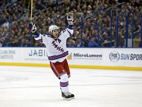 Martin St. Louis celebrates the Rangers' first goal during his return to Tampa Bay on Wednesday night.