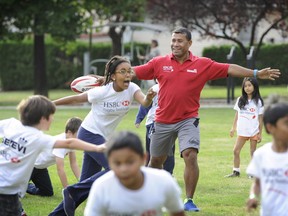 Messing with the "King" Waisale Serevi  (c) in red (the Wayne Gretzky of sevens rugby) and others hosted a special Rugby Canada kids camp clinic promoting "sevens rugby" for kids at the Fraserview Boys and Girls Club in east Vancouver (Mark Van Manen/PNG)