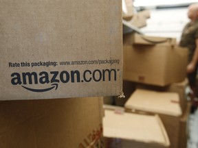 In this Oct. 18, 2010 photo, an Amazon.com package sits in a UPS truck in Palo Alto, Calif. Amazon is offering same-day deliver in Vancouver. (AP Photo/Paul Sakuma, File)