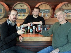 From left, Province beer writer Jan Zeschky, Tap & Barrel's Peter Gordon and Central City brewmaster Gary Lohin toast the Red Racer IPA.