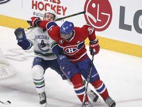 MONTREAL, QUE.: December 09, 2014 -- Montreal Canadiens P.K. Subban holds off Vancouver Canucks Nick Bonino as he handles the puck in his own end during third period of National Hockey League game in Montreal Tuesday December 09, 2014. ({John Mahoney / MONTREAL GAZETTE)