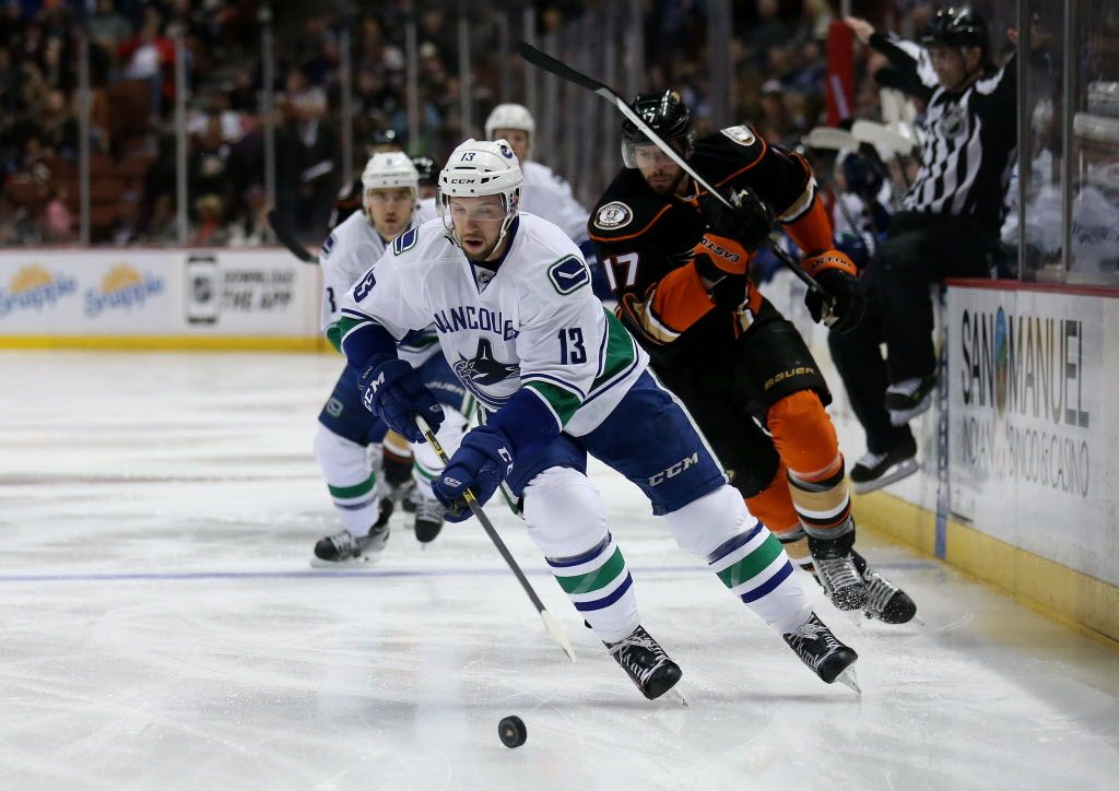 ANAHEIM, CA - DECEMBER 28:  Nick Bonino #13 of the Vancouver Canucks controls the puck ahead of Ryan Kesler #17 of the Anaheim Ducks at Honda Center on December 28, 2014 in Anaheim, California.  (Photo by Stephen Dunn/Getty Images)
