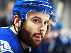 VANCOUVER, BC - JANUARY 10:  Zack Kassian #9 of the Vancouver Canucks looks on from the bench during their NHL game against the St. Louis Blues at Rogers Arena January 10, 2014 in Vancouver, British Columbia, Canada.  Vancouver won 2-1. (Photo by Jeff Vinnick/NHLI via Getty Images)