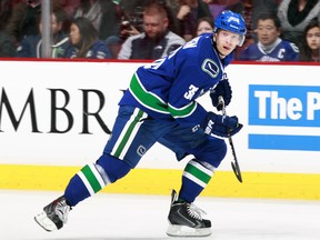 VANCOUVER, BC - MARCH 8:  Jannik Hansen #36 of the Vancouver Canucks skates up ice during their NHL game against the Calgary Flames at Rogers Arena March 8, 2014 in Vancouver, British Columbia, Canada.  (Photo by Jeff Vinnick/NHLI via Getty Images)