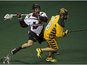 Swarm sniper Logan Schuss races away from Stealth defender Chris O'Dougherty in a game last year. Schuss  is sitting out NLL action this season. (Province Files.)
