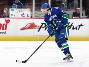 This is Bobby Sanguinetti going through the warm-up paces for the Vancouver Canucks before a Nov. 14 game against Arizona. He was called up from the AHL to be an extra defenceman that night and it looks like he'll do the same for the upcoming California road trip. (Photo by Jeff Vinnick/NHLI via Getty Images)