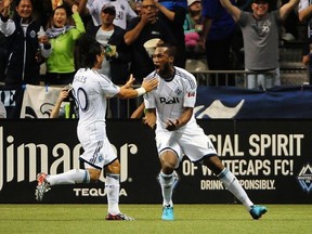 Mauro Rosales (left) hopes to set up more goals for the Whitecaps in 2015. (Anne-Marie Sorvin-USA TODAY Sports)