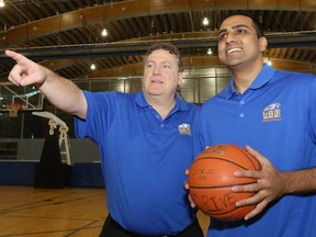 UBC men's basketball head coach Kevin Hanson (left) points to the future of 'Birds hoops earlier this week at the Richmond Oval with newly-hired assistant coach Pasha Bains. (Kim Stallknecht, PNG)