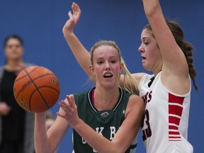 Oak Bay's Lauren Yearwood (left) guarded by Mouat's Alicia Roufosse at the 2015 Top 10 Shoot-Out lsemifinals last Friday in Coquitlam. (Gerry Kahrmann, PNG photo)