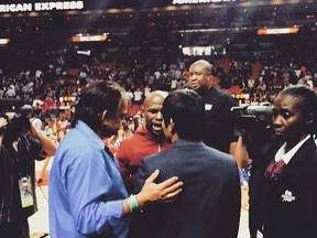 Floyd Mayweather and Manny Pacquiao seen face-to-face during half-time at the Miami Heat game.