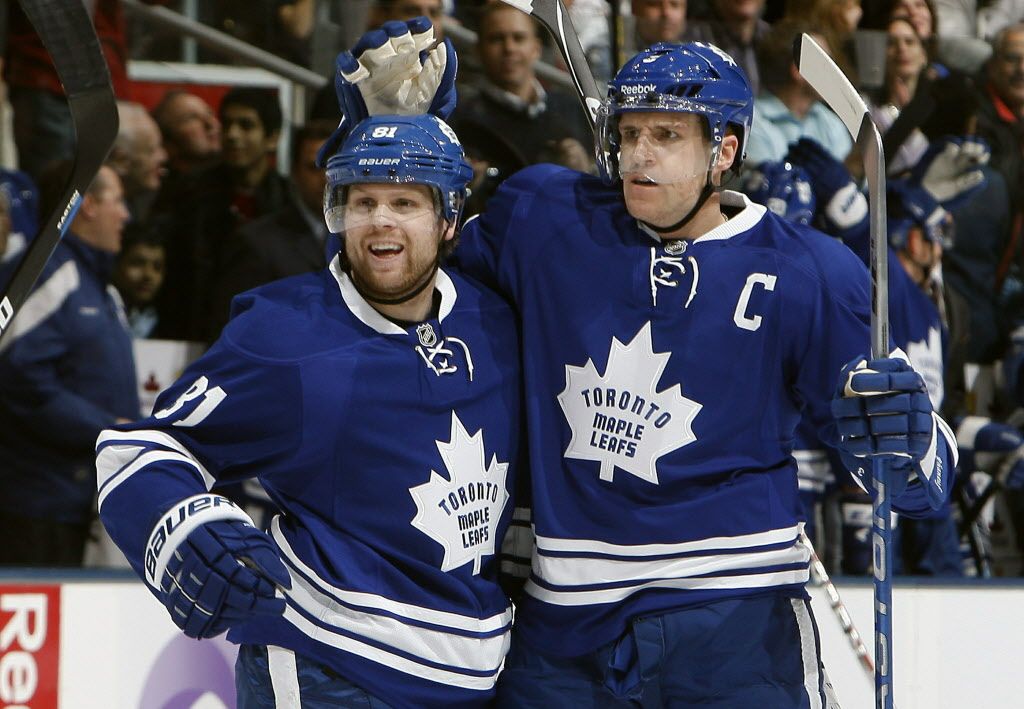 TORONTO, CANADA - JANUARY 7: Phil Kessel #81 and Dion Phaneuf #3 of the Toronto Maple Leafs celebrate Dion Phaneuf goal against the Detroit Red Wings during NHL action at The Air Canada Centre January 7, 2012 in Toronto, Ontario, Canada. (Photo by Abelimages/Getty Images)