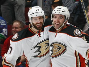 VANCOUVER, BC - JANUARY 27:   Ryan Kesler #17 congratulate Kyle Palmieri #21 of the Anaheim Ducks who scored against the Vancouver Canucks during their NHL game at Rogers Arena January 27, 2015 in Vancouver, British Columbia, Canada.  (Photo by Jeff Vinnick/NHLI via Getty Images)