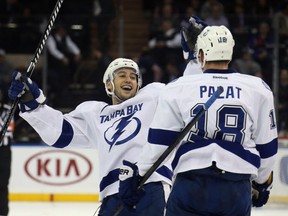 NEW YORK, NY - DECEMBER 01: Tyler Johnson #9 of the Tampa Bay Lightning celebrates a shorthanded empty net goal by Ondrej Palat #18 against the New York Rangers at Madison Square Garden on December 1, 2014 in New York City. The Lightning defeated the Rangers 6-3.   (Photo by Bruce Bennett/Getty Images)