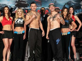 Mike Alvarado (left) and Brandon Rios (right) pose for photos after both boxers made weight for their third bout. Photo: Chris Farina/Top Rank